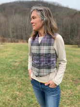 Load image into Gallery viewer, Woman standing in a field with hands in pockets looking to the left, wearing View A 222 Vintage Vests, collarless v-neck and four welt pockets.
