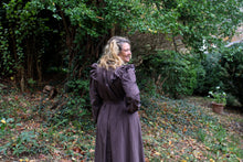 Load image into Gallery viewer, Close up of the back of the Calico Day Dress on a woman outside with her hand on her hip
