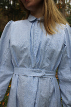 Load image into Gallery viewer, Close up of the blue calico Day Dress on a woman
