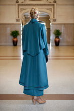 Load image into Gallery viewer, Back view of Young blonde woman standing in a lobby wearing the Metropolitan Suit.
