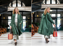 Load image into Gallery viewer, Front and back view of white blonde woman walking holding a woven bag wearing the 254 Swing Coat
