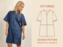 Load image into Gallery viewer, Woman wearing a blue dress next to a sewing pattern illustration on a beige background
