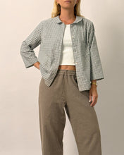 Load image into Gallery viewer, Woman wearing a checkered jacket, white top, and brown pants on a plain background
