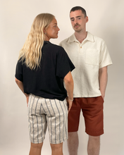 Load image into Gallery viewer, Two people standing side by side wearing casual clothing against a plain background
