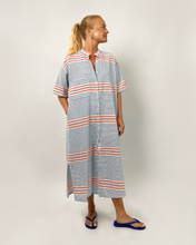 Load image into Gallery viewer, Woman wearing a striped dress on a plain background
