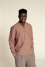 Load image into Gallery viewer, Man wearing a brown long-sleeve shirt and beige pants against a beige background
