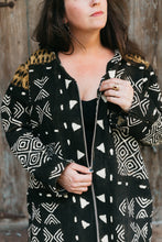 Load image into Gallery viewer, Brunette white women wearing the #157 Moroccan Djellaba pulling down the center front zipper.
